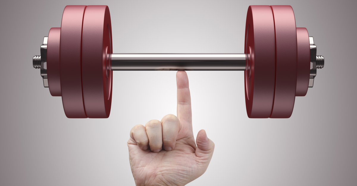 Weight lifting with just one finger. Concept of Power, strength and training.